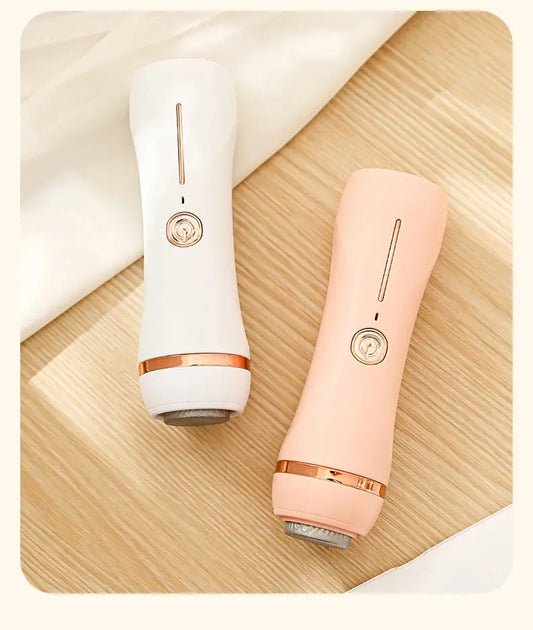 Front view of two Rolli™ SmoothPro electric foot grinders in white and pink on a table – showing various attachments for effective callus and dead skin removal